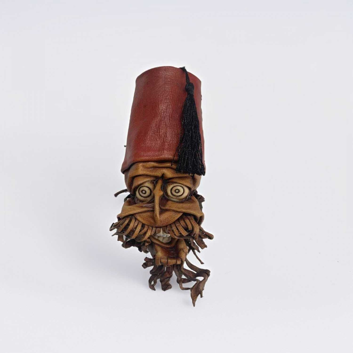 Fez hat moulded leather wall mask
